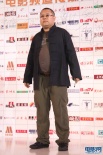 著名导演高群书亮相传媒大奖红毯 身材再次发福